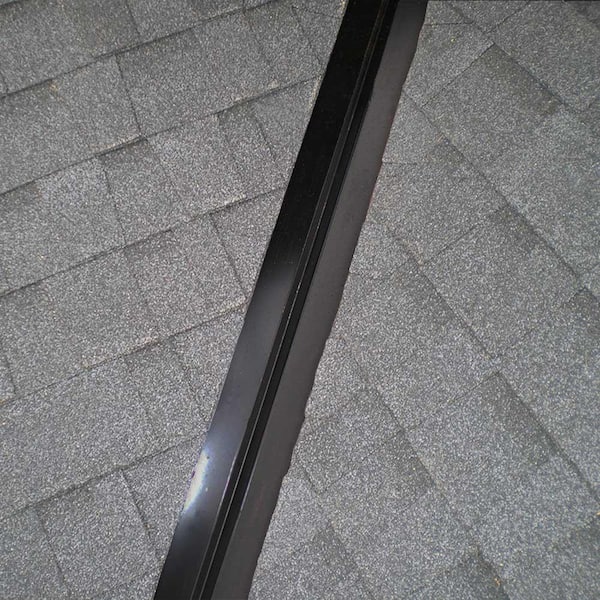Open metal W-valley flashing between two slopes of an asphalt shingle roof